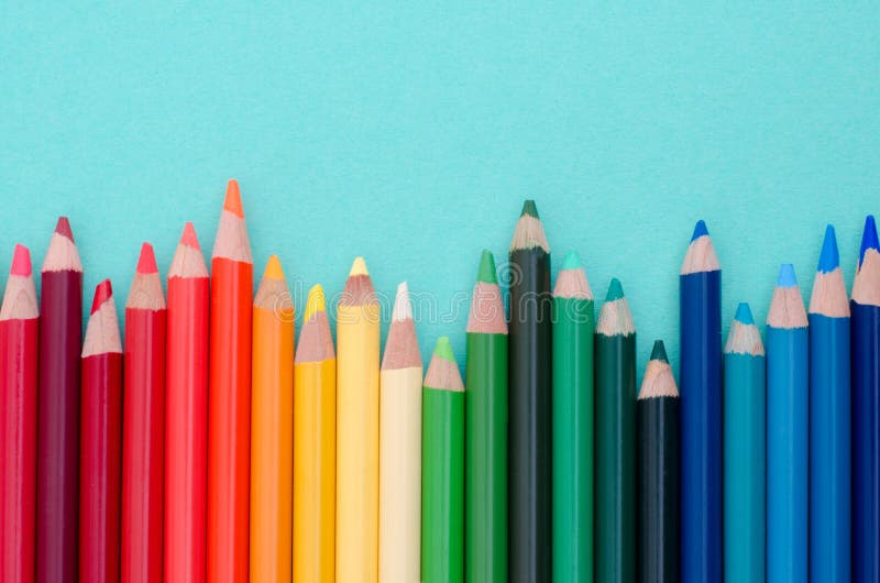 Colored Pencils on Blue Color Background. Stock Photo Image of