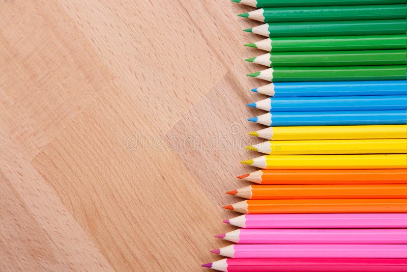 Colored pencils colored pencils on the wooden table clous-up.