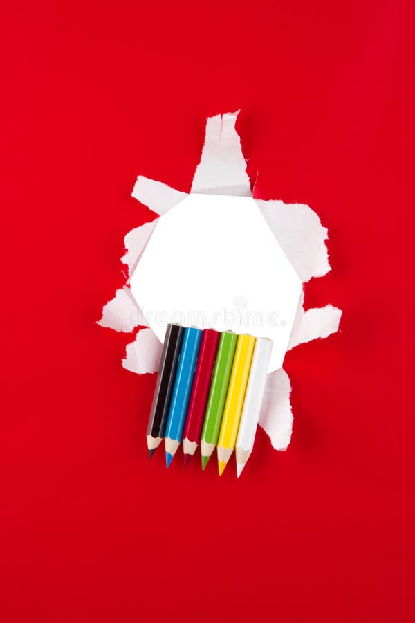 Colored pencils on red stock images