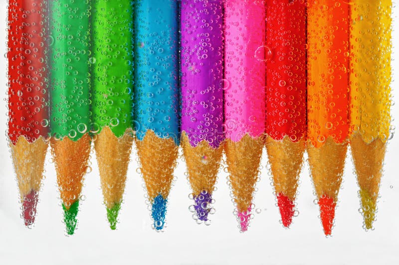 Colored pencils sunken in water