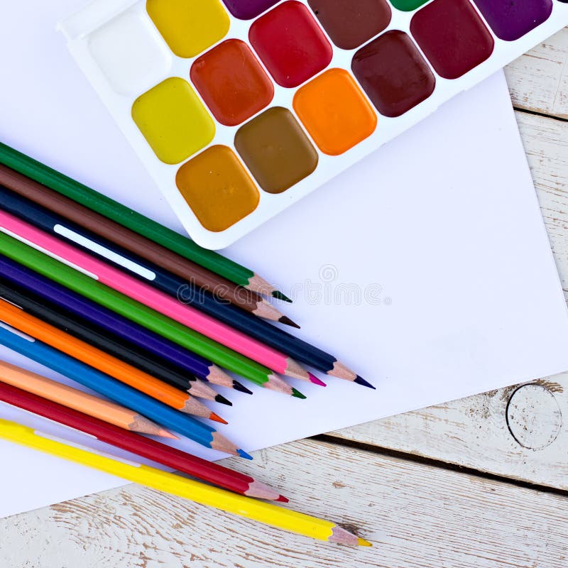 https://thumbs.dreamstime.com/b/colored-pencils-water-colors-paper-desk-53630267.jpg