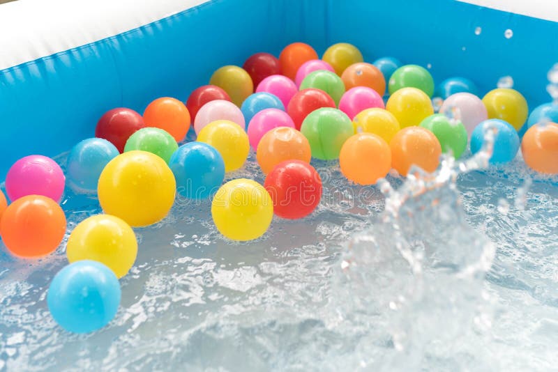 Colored Plastic Balls in the Inflatable Pool for Fun. Multicolored