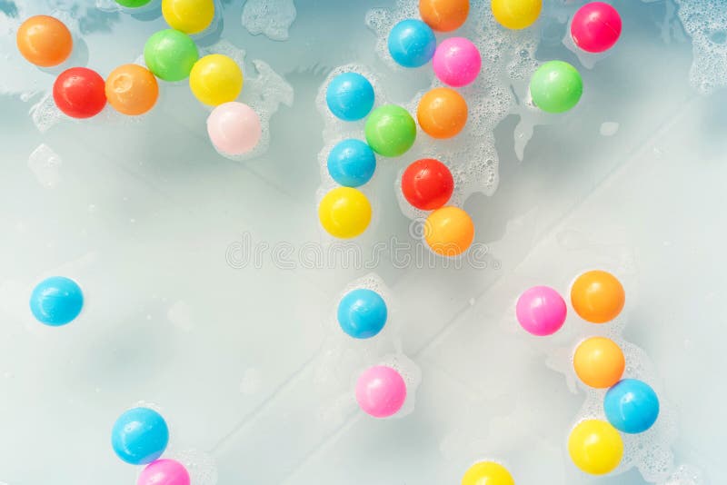 Colored Plastic Balls in the Inflatable Pool for Fun. Multicolored