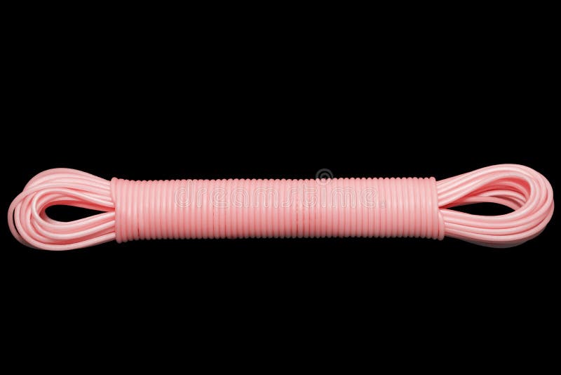Colored plastic cord insulated on a black background. twisted cable stock image