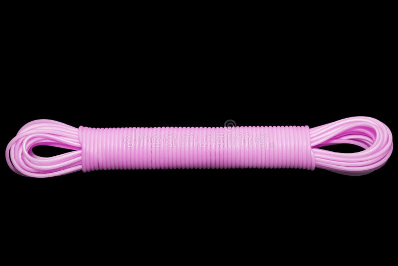 Colored plastic cord insulated on a black background. twisted cable royalty free stock images