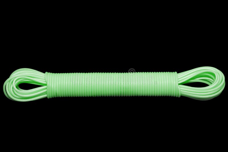 Colored plastic cord insulated on a black background. twisted cable royalty free stock image