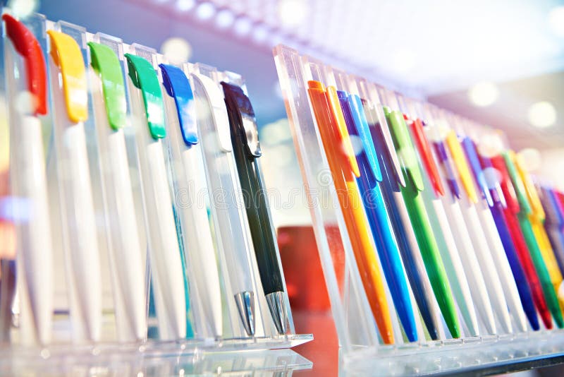 Colored plastic pens on store display stock photography