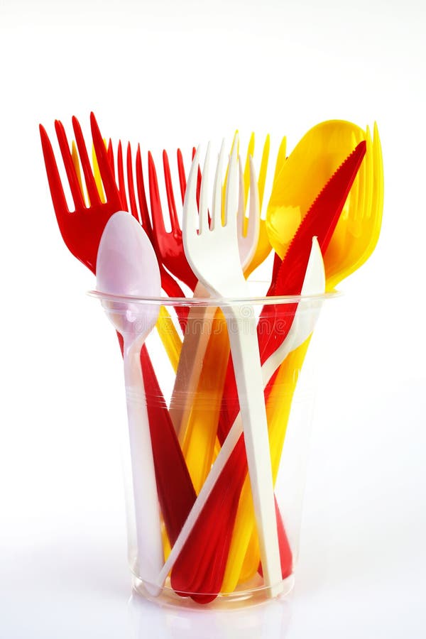 Colored plastic utensils stock photography