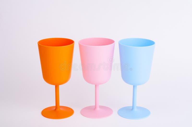 Colored Plastic Wine Glasses on White Background. Stock Photo Image