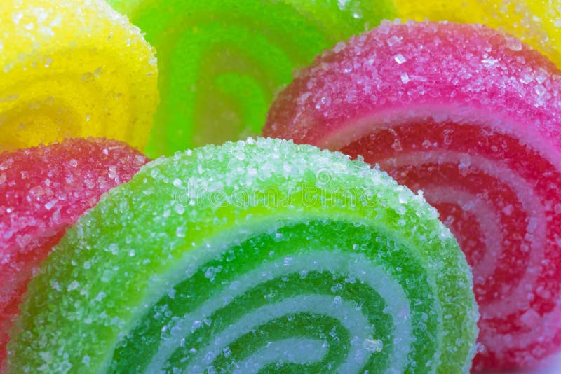 Colored Rolls of Fruit Marmalade in Sugar Closeup, Selective Focus