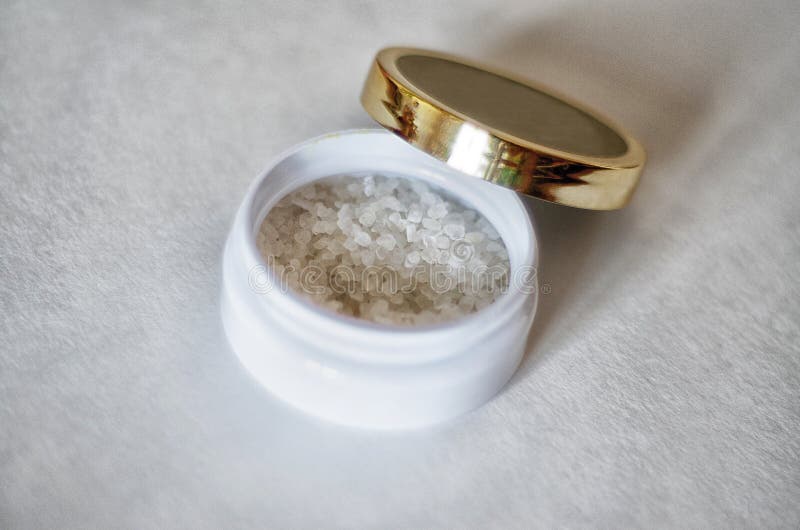 Bath Salt Crystals in White Jar on Light Background Stock Photo Image