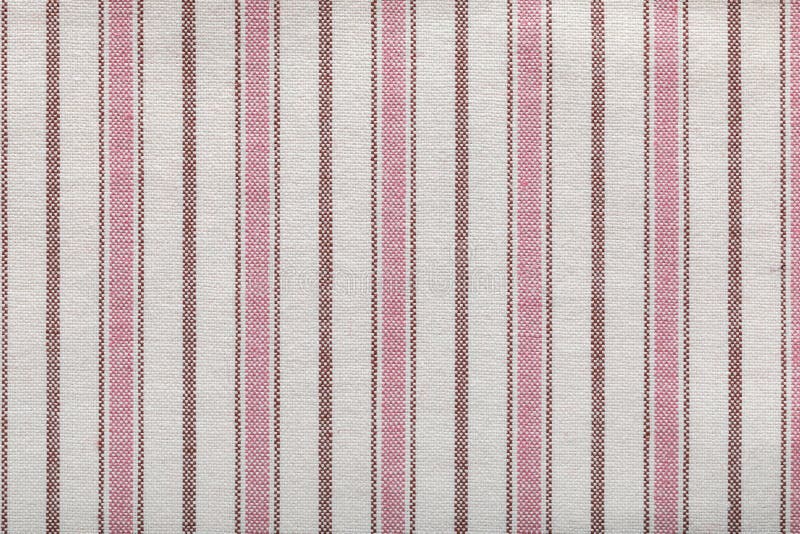 Colored striped coarse linen fabric texture closeup as background. Rustic canvas fabric texture