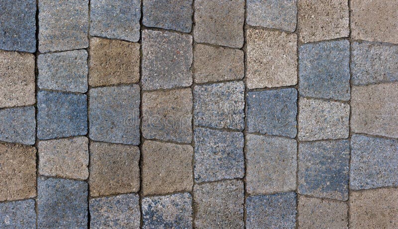 colored trapezoid concrete tiles pavement in high angle view - full frame background and texture