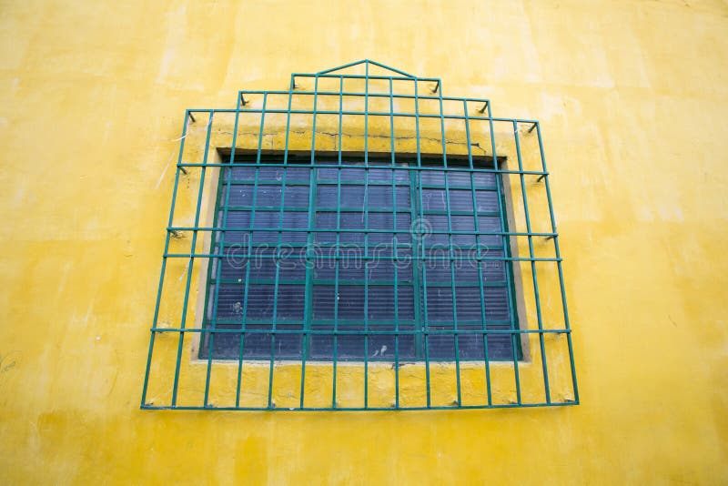 Colored wall and window, colonial architecture in Cali