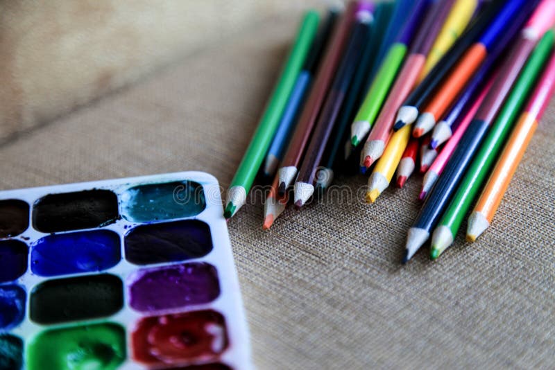 Colored Watercolor Pencils and Watercolor Paints. Creativity and Drawing. Stock Photo Image of