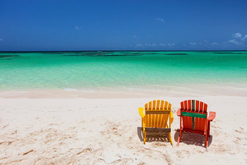 Colorful Adirondack Lounge Chairs At Caribbean Beach Stock 