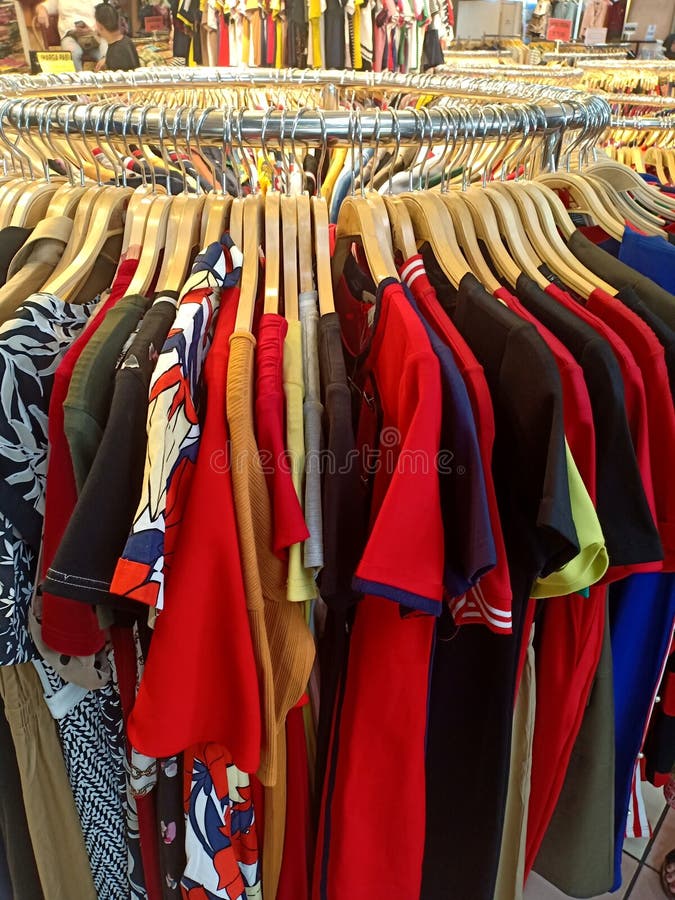 Colorful Apparel Hang on Circle Iron Rail in a Clothing Store Stock ...