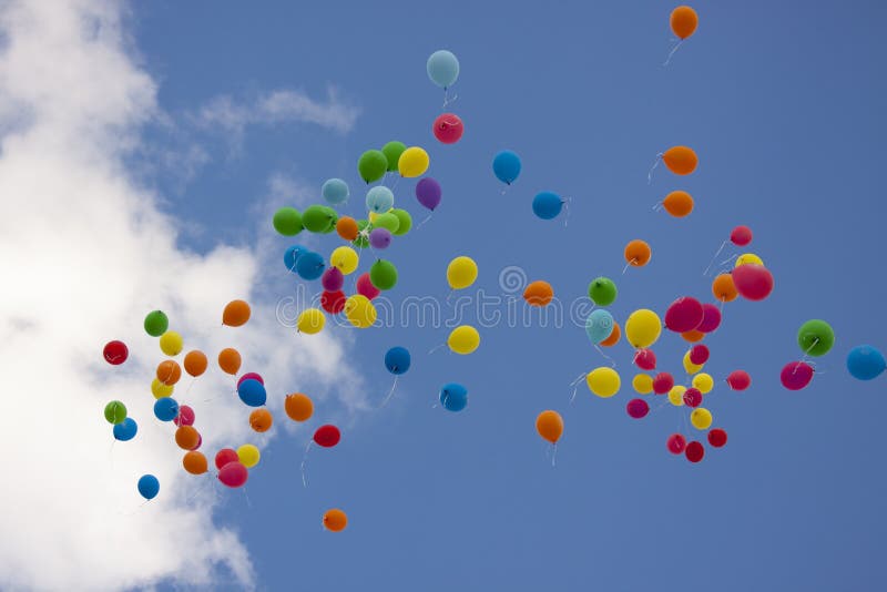Colorful Balloons Filled With Helium Fly In The Blue Sky Stock Image