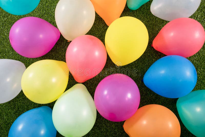 Balloons on a grass stock photo. Image of congratulations 2391558