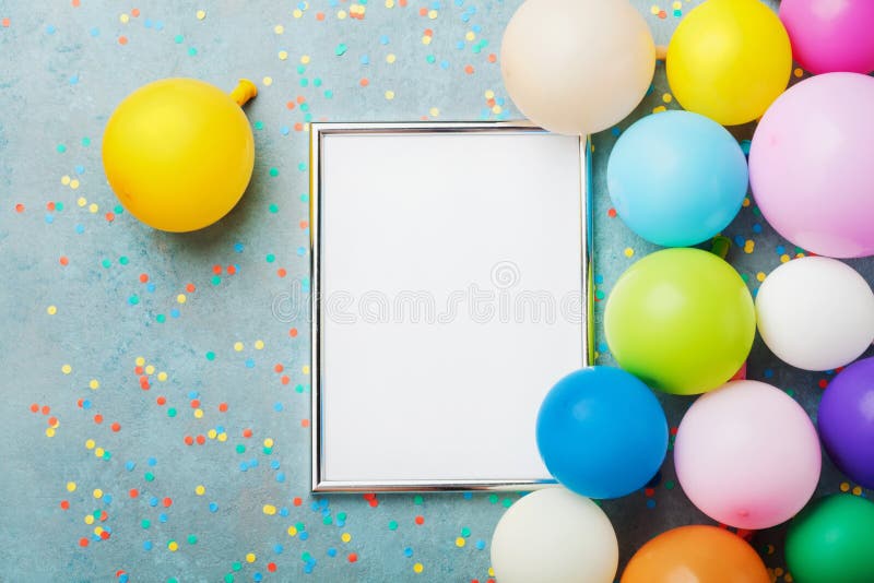 Colorful Balloons Silver Frame And Confetti On Blue Table 