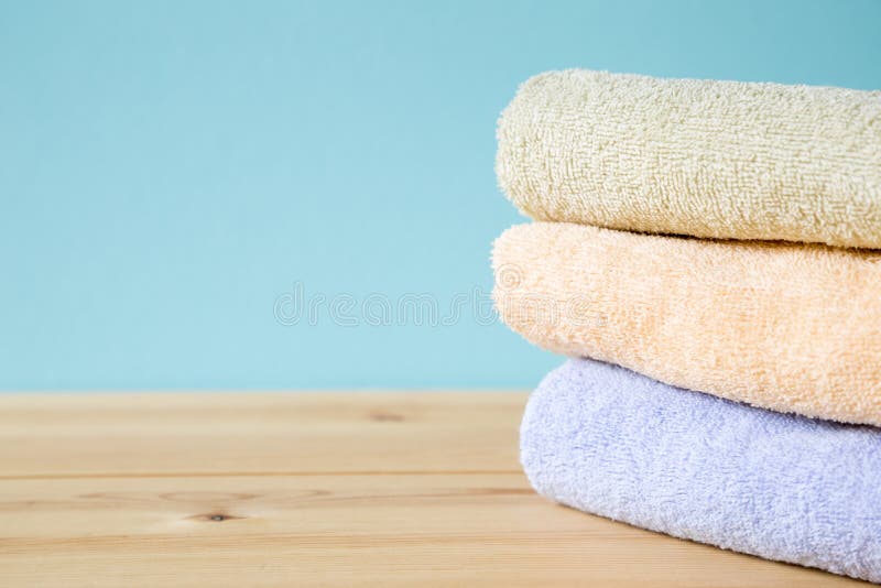 Colorful Bath Towels on Wooden Table Stock Photo Image of folded
