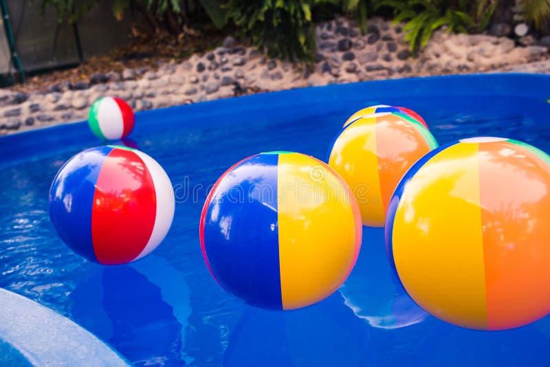 Colorful Beach Balls Floating in Pool Stock Photo Image of afternoon