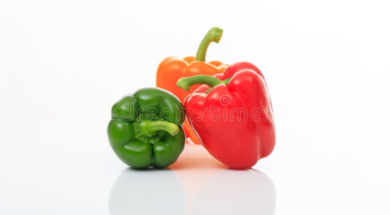 Colorful bell peppers on white background