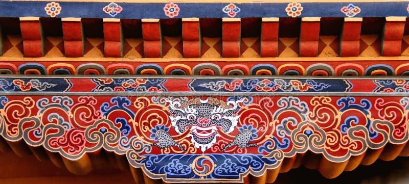 Colorful Bhutanese art of Tibetan dragon painted on wood, Bhutan