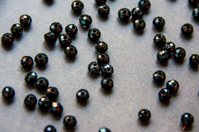 Colorful, black beads and stones isolated grey background stock photography Colorful, black beads and stones isolated grey background stock photography