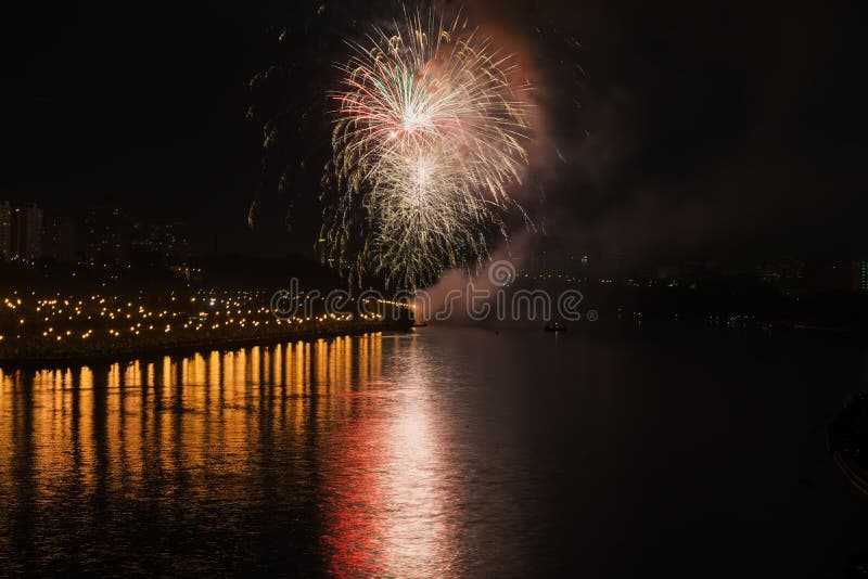 Colorful bright fireworks, salute of various colors in night sky with reflection in the lake. Abstract holiday royalty free stock photo Colorful bright fireworks, salute of various colors in night sky with reflection in the lake. Abstract holiday royalty free stock photo