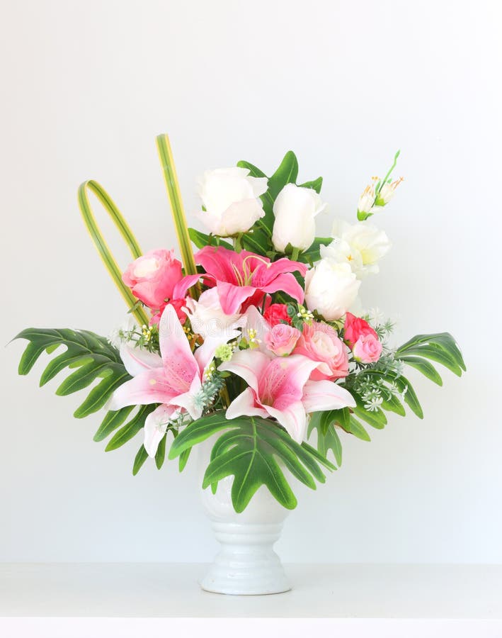 Colorful bunch of flowers in white vase