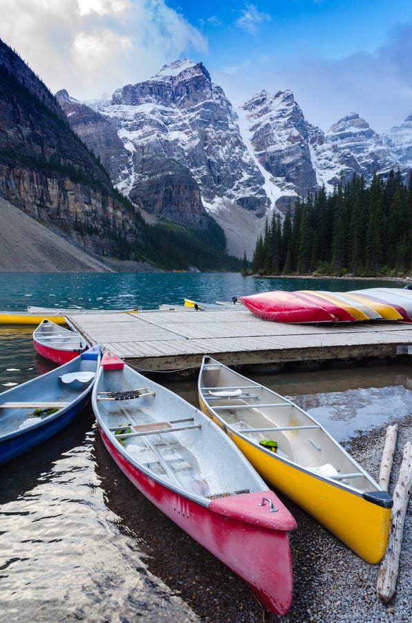 Colorful canoes docked at Moraine Lake stock images Colorful canoes docked at Moraine Lake stock images