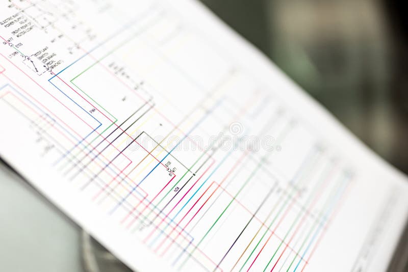 Colorful cars electric wiring scheme on paper sheet royalty free stock photo Colorful cars electric wiring scheme on paper sheet royalty free stock photo