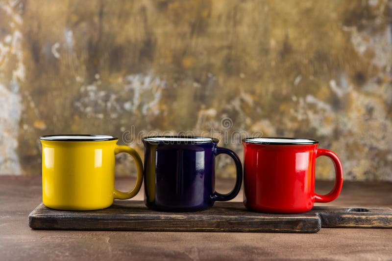 Colorful ceramic mugs royalty free stock images