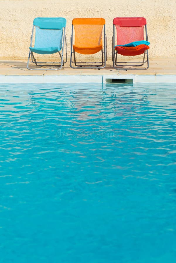 Chairs by Swimming Pool stock image. Image of swim, swimming 2705361