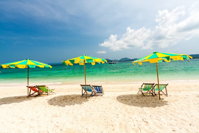 Colorful chairs and umbrella on tropical beach at Koh Khai Nok I