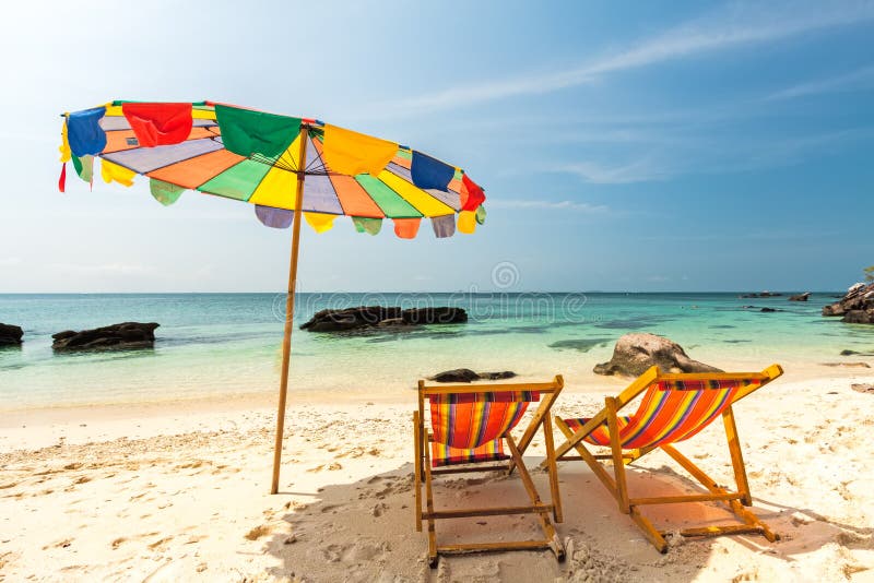 Colorful chairs and umbrella on tropical beach at Koh Khai Nok I