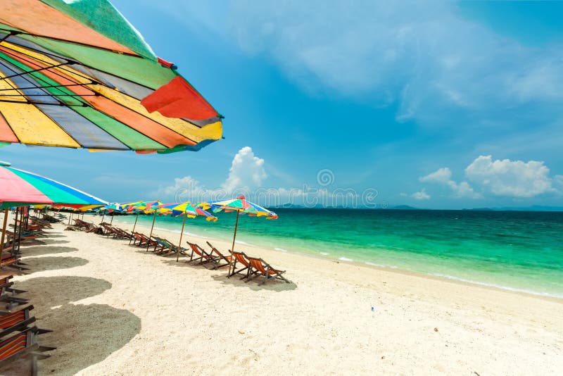 Colorful chairs and umbrella on tropical beach at Koh Khai Nok I