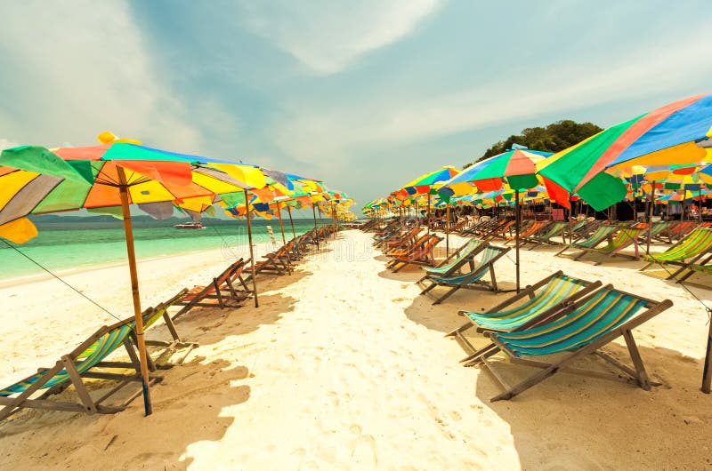Colorful chairs and umbrella on tropical beach at Koh Khai Nok I