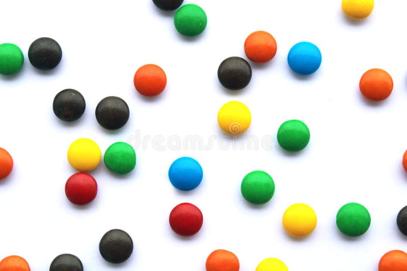 Colorful Chocolate Candies on White Background, Small Candy Mix Stock