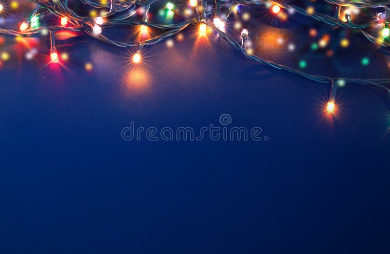 colorful christmas lights on blue background