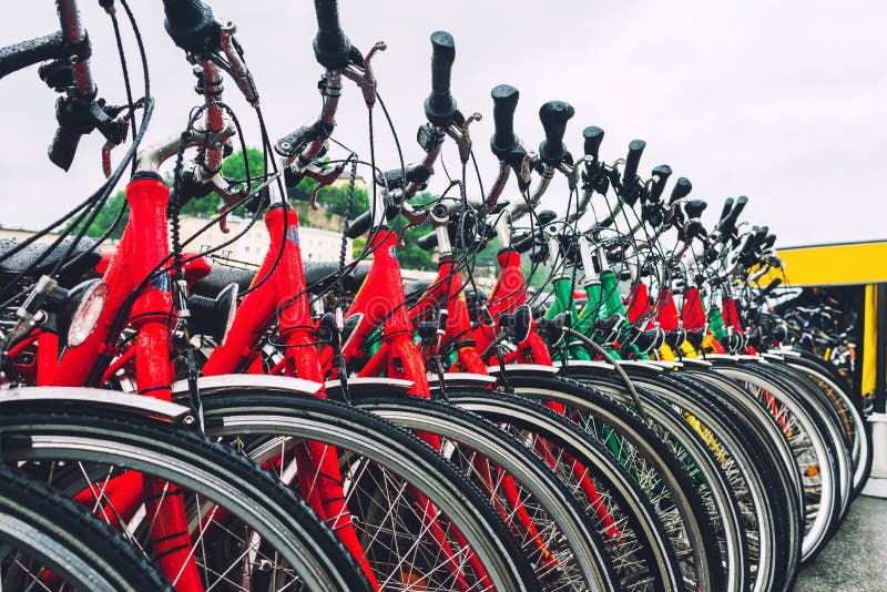 Colorful city bikes in a row