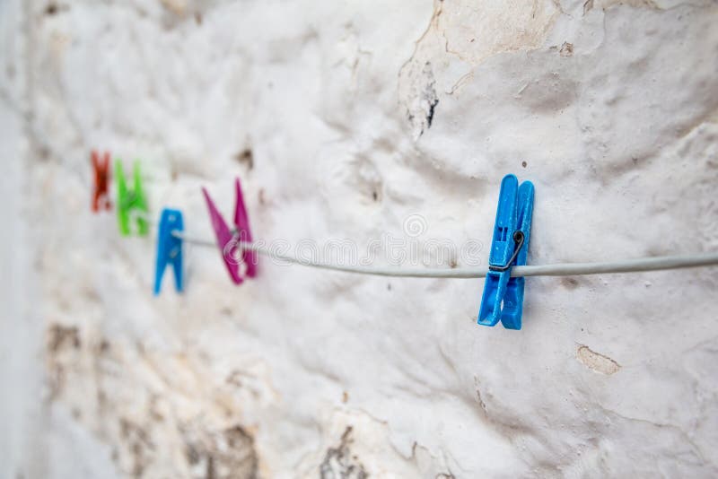 Colorful Clothes Pins On Rope Against Wall Stock Image Image Of 