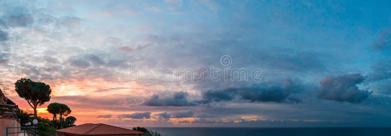 Colorful clouds in the sky at sunset stock image