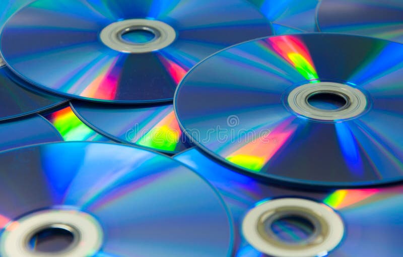 Colorful Compact Discs Set of DVD Scattered on a Table Stock Photo