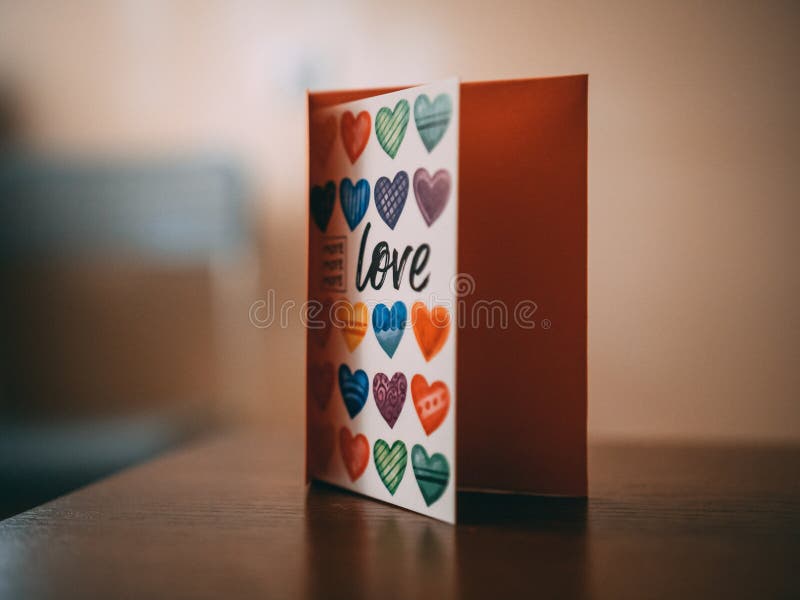 Colorful copybook with hearts and love written on it.