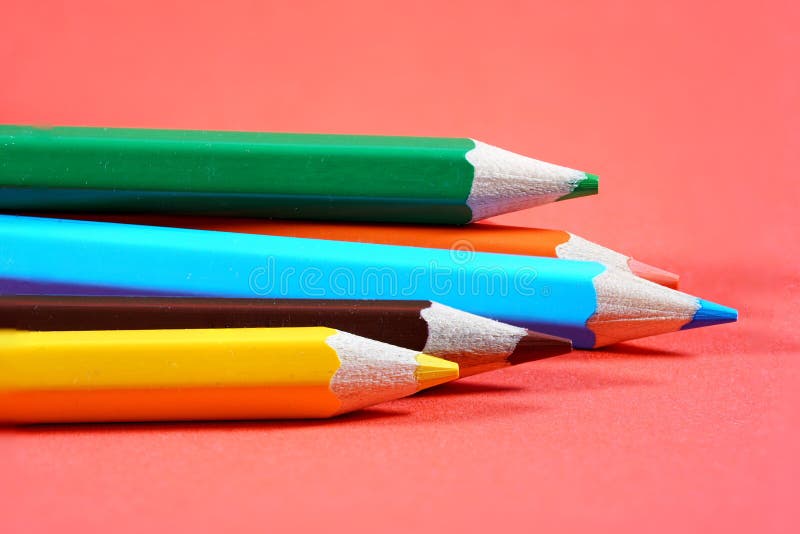 Colorful crayons, pencils with plain paper as a background with structure royalty free stock image
