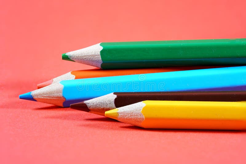 Colorful crayons, pencils with plain paper as a background with structure royalty free stock images
