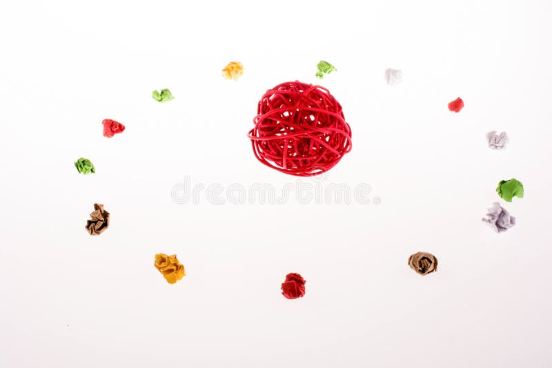 Colorful crumpled paper form a circle with spool royalty free stock images