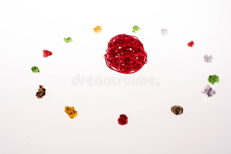 Colorful crumpled papers around a ball stock image